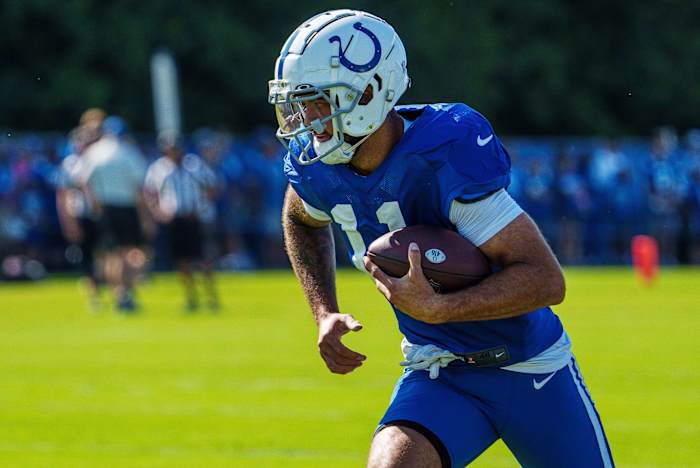 July 31, 2023; Westfield, IN, USA; Indianapolis Colts wide receiver Michael Pittman Jr. (11) runs after catching a pass Monday, July 31, 2023, during training camp at the Grand Park Sports Campus in Westfield, Indiana. Mandatory Credit: Mykal McEldowney-USA TODAY Sports